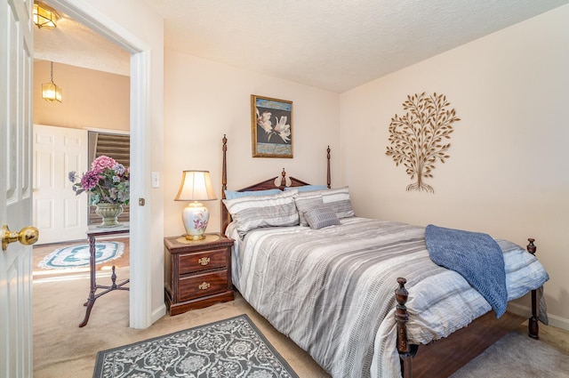 carpeted bedroom with a textured ceiling