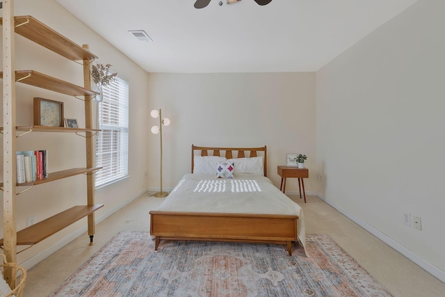 bedroom with ceiling fan and carpet floors