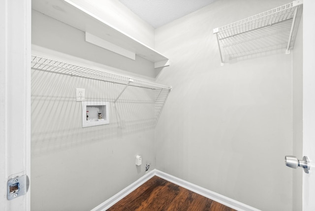 laundry area featuring dark wood-type flooring and hookup for a washing machine