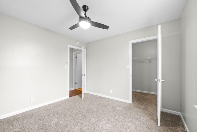 unfurnished bedroom with carpet floors, a closet, and ceiling fan