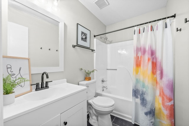 full bathroom with vanity, tile patterned flooring, toilet, a textured ceiling, and shower / tub combo