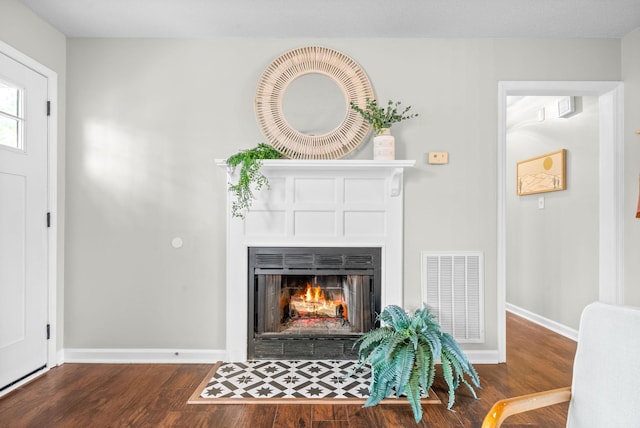 living room featuring dark wood-type flooring