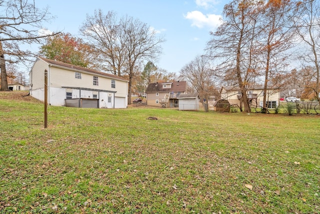 view of yard featuring a garage