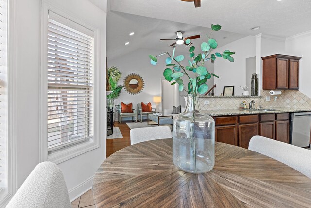 dining room with lofted ceiling, ceiling fan, baseboards, and recessed lighting