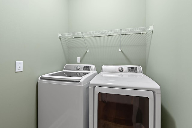 laundry area featuring laundry area and washing machine and dryer