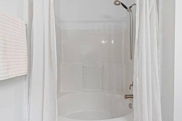 full bathroom featuring shower / bath combo with shower curtain