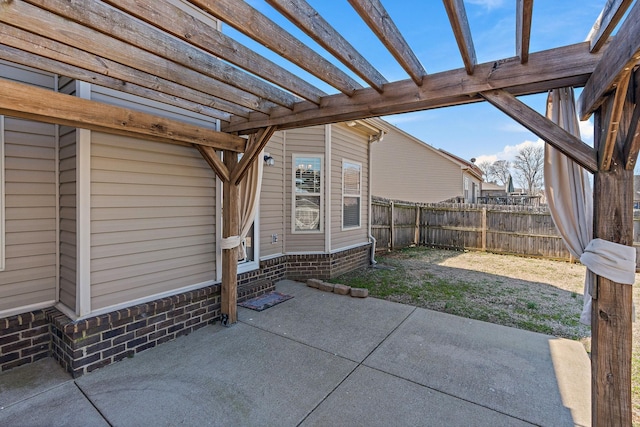 view of patio featuring fence and a pergola