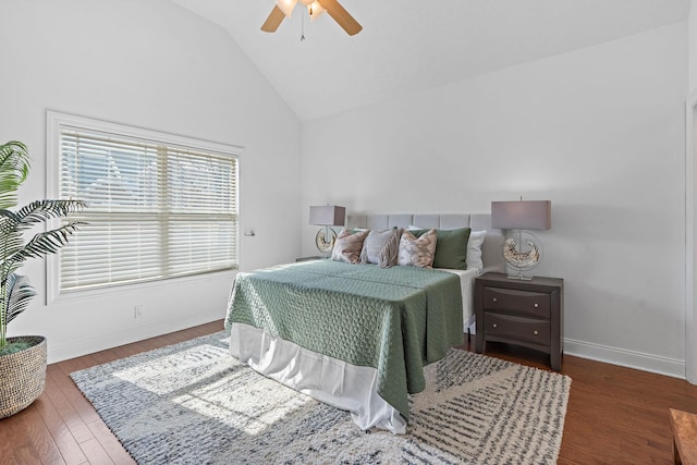 bedroom with lofted ceiling, wood finished floors, a ceiling fan, and baseboards