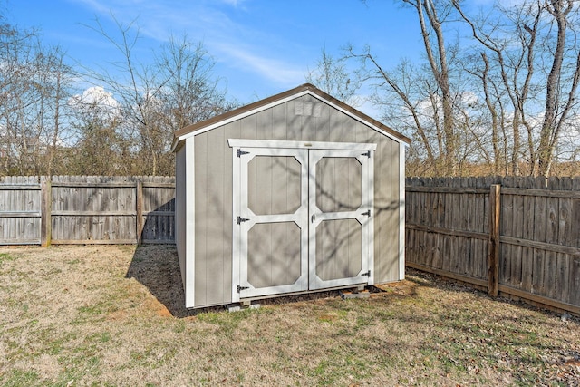 view of shed with a fenced backyard