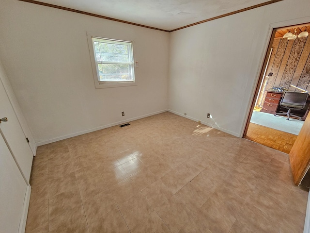 spare room featuring ornamental molding