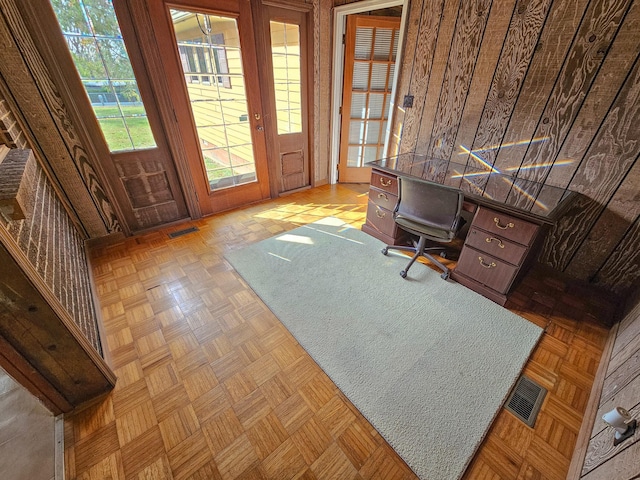 office with wooden walls and light parquet floors