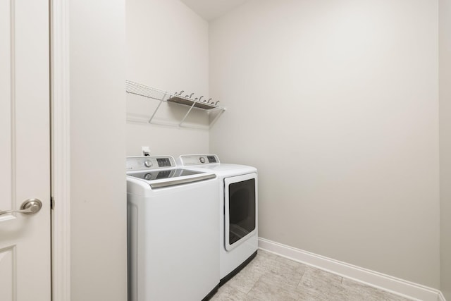 laundry area with washer and clothes dryer