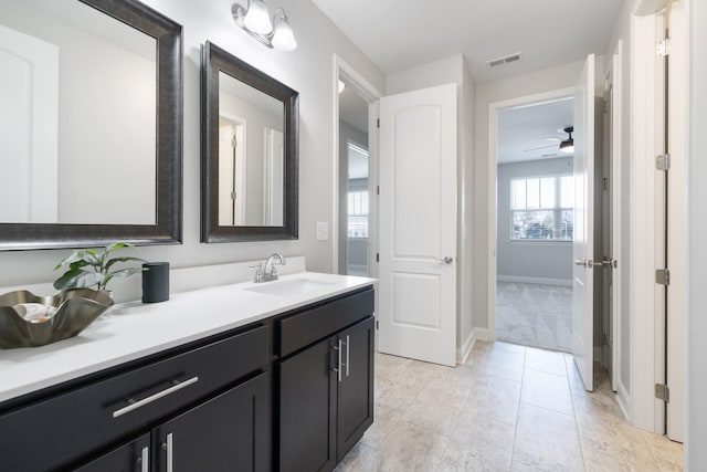 bathroom featuring tile patterned flooring, vanity, and ceiling fan