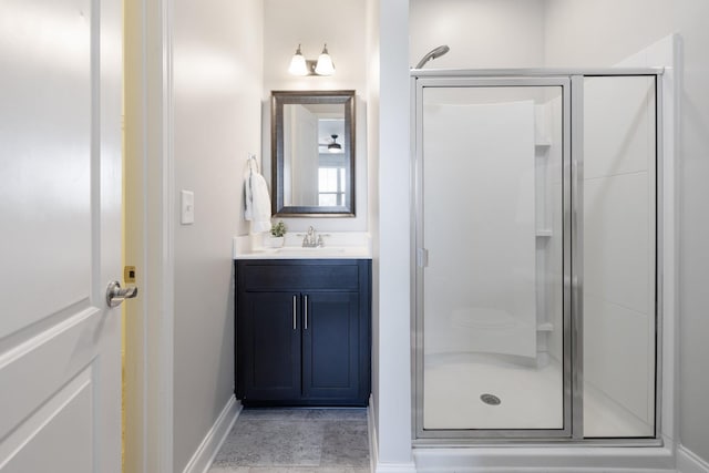 bathroom with vanity and a shower with shower door