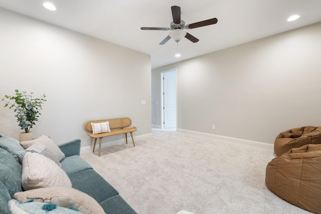 living room with carpet floors and ceiling fan