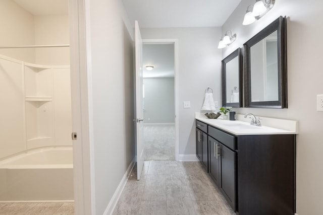 bathroom with hardwood / wood-style floors, vanity, and shower / tub combination