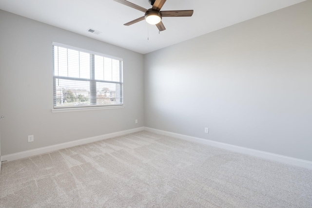 spare room with light carpet and ceiling fan