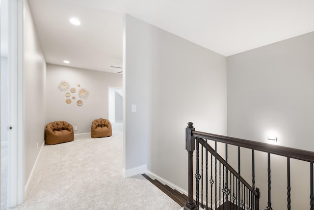 hallway with carpet floors