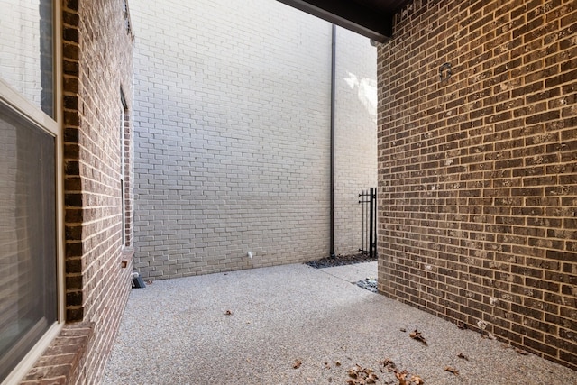 view of side of home featuring a patio area