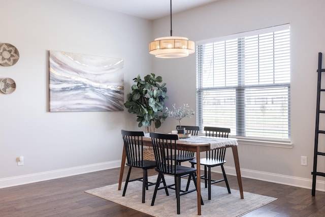 dining area with dark hardwood / wood-style floors