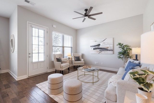 living room with dark hardwood / wood-style floors and ceiling fan