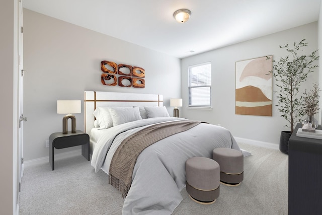 bedroom featuring light colored carpet