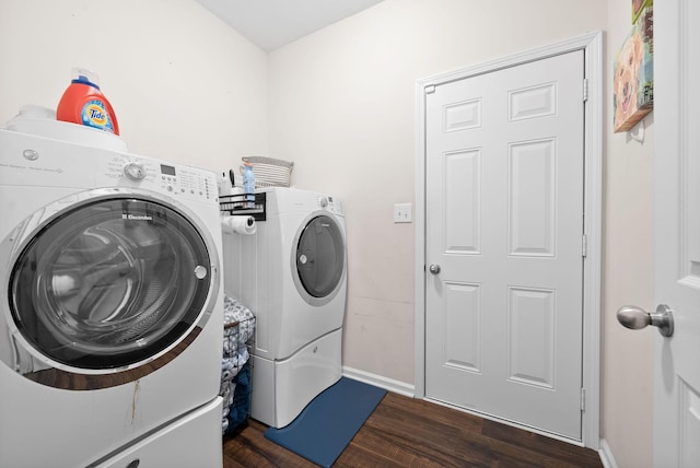 laundry area with separate washer and dryer and dark hardwood / wood-style floors