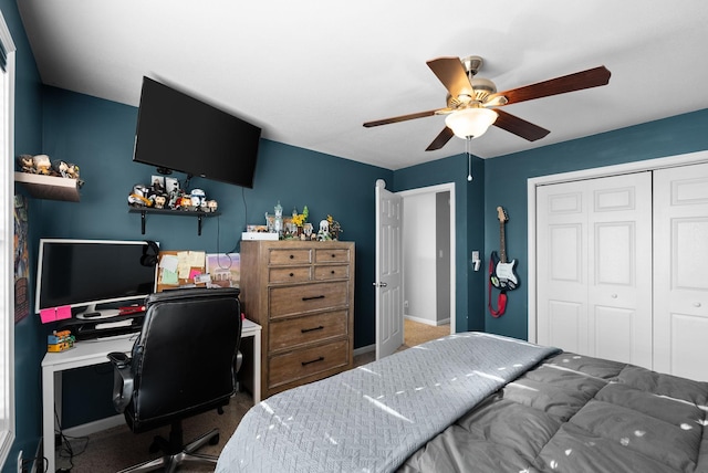 bedroom featuring ceiling fan, a closet, and carpet