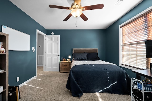 bedroom featuring ceiling fan and carpet