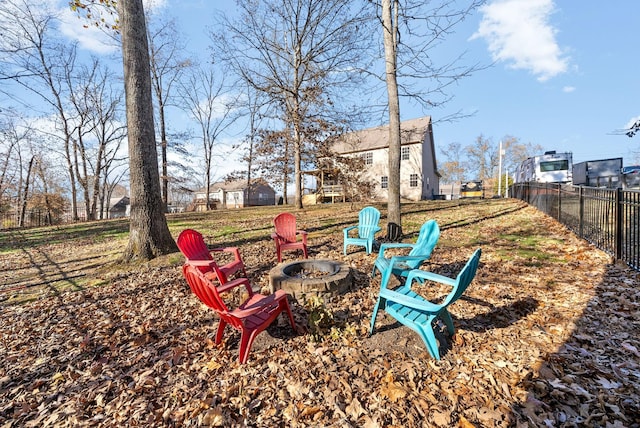 view of yard featuring an outdoor fire pit