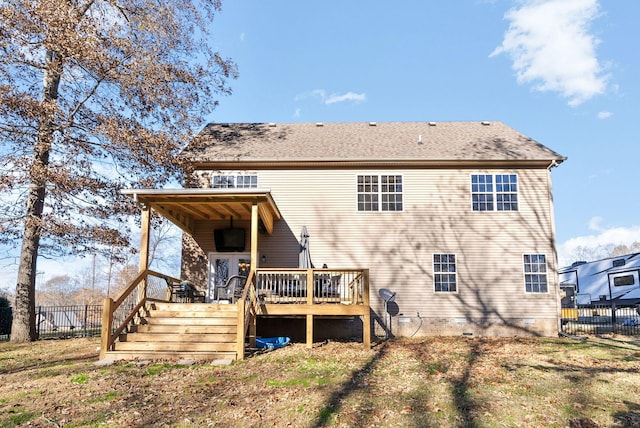 back of house featuring a deck