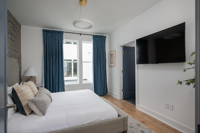 bedroom featuring wood-type flooring