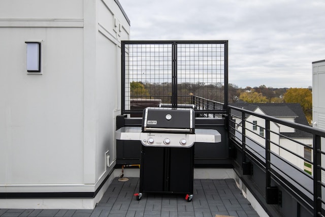 wooden deck featuring area for grilling