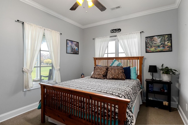 bedroom featuring multiple windows, dark colored carpet, ceiling fan, and ornamental molding