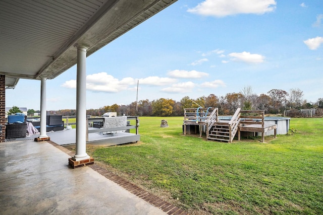 view of yard featuring a swimming pool side deck