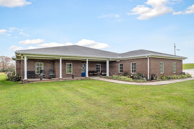 single story home with a patio area and a front yard