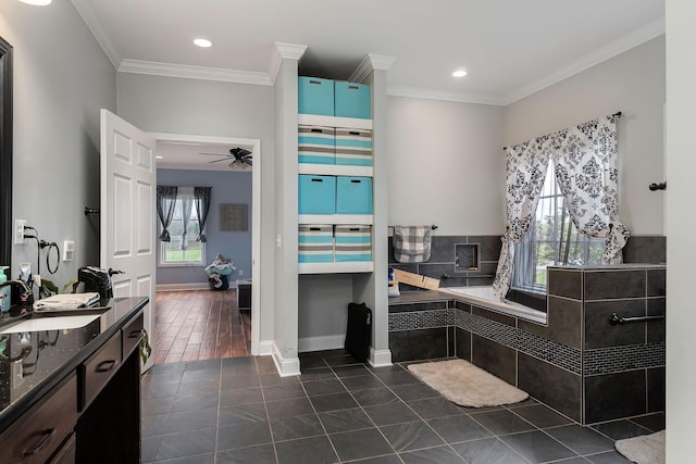 bathroom with hardwood / wood-style floors, ceiling fan, crown molding, and vanity