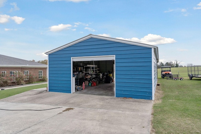 garage featuring a lawn