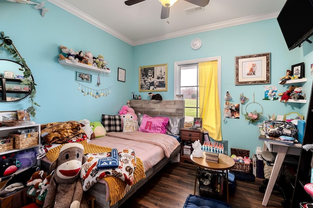 bedroom with ceiling fan, crown molding, and dark wood-type flooring