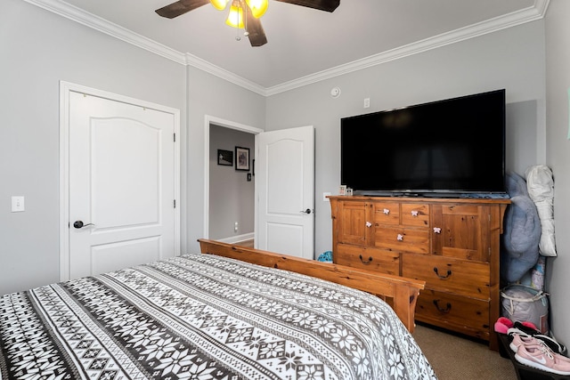 bedroom with carpet flooring, a closet, ceiling fan, and crown molding