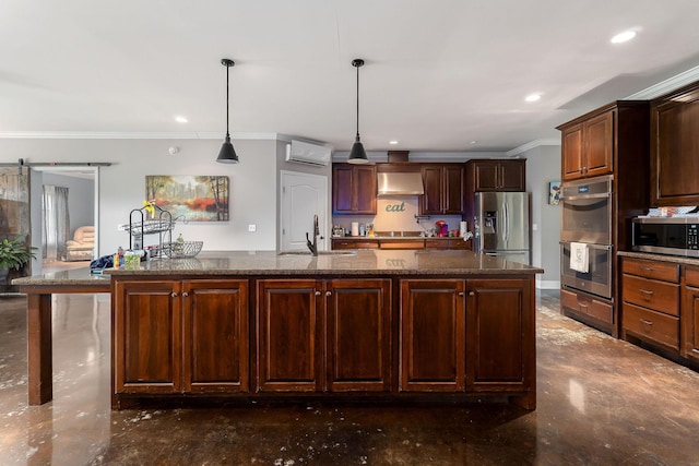 kitchen featuring wall chimney exhaust hood, sink, an island with sink, and appliances with stainless steel finishes