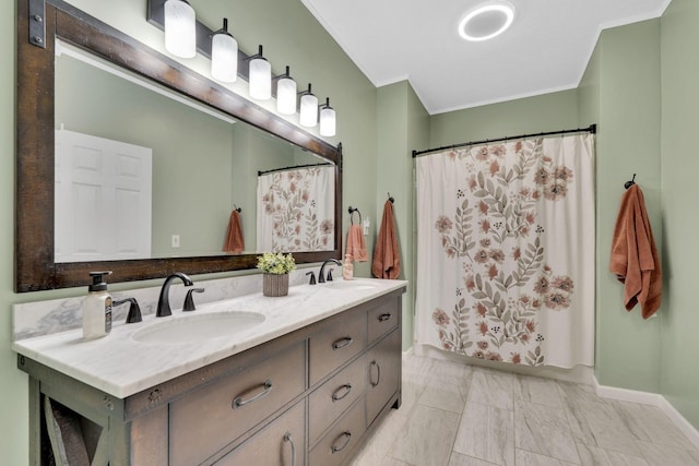 bathroom with a shower with curtain, vanity, and ornamental molding