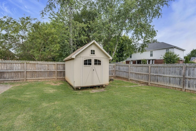 view of outbuilding featuring a lawn