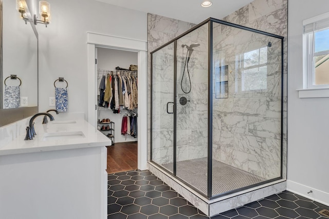 bathroom with vanity, an enclosed shower, and hardwood / wood-style flooring