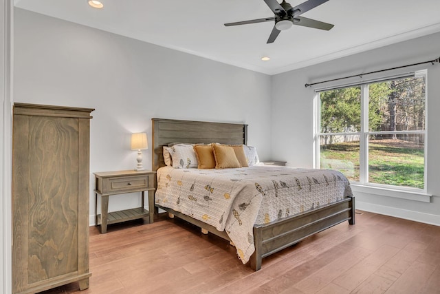 bedroom with wood-type flooring and ceiling fan