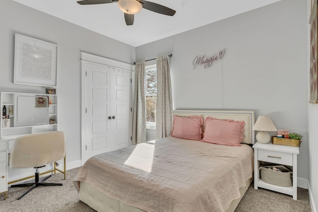 carpeted bedroom featuring a closet and ceiling fan