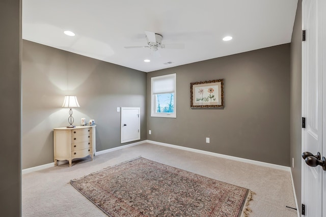 interior space with ceiling fan