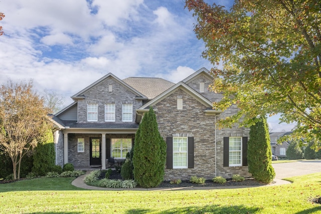 craftsman inspired home with a front yard