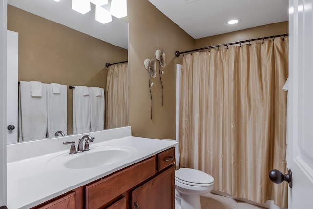 bathroom featuring tile patterned flooring, vanity, toilet, and a shower with shower curtain