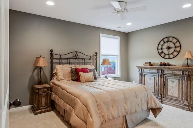 bedroom featuring light carpet and ceiling fan